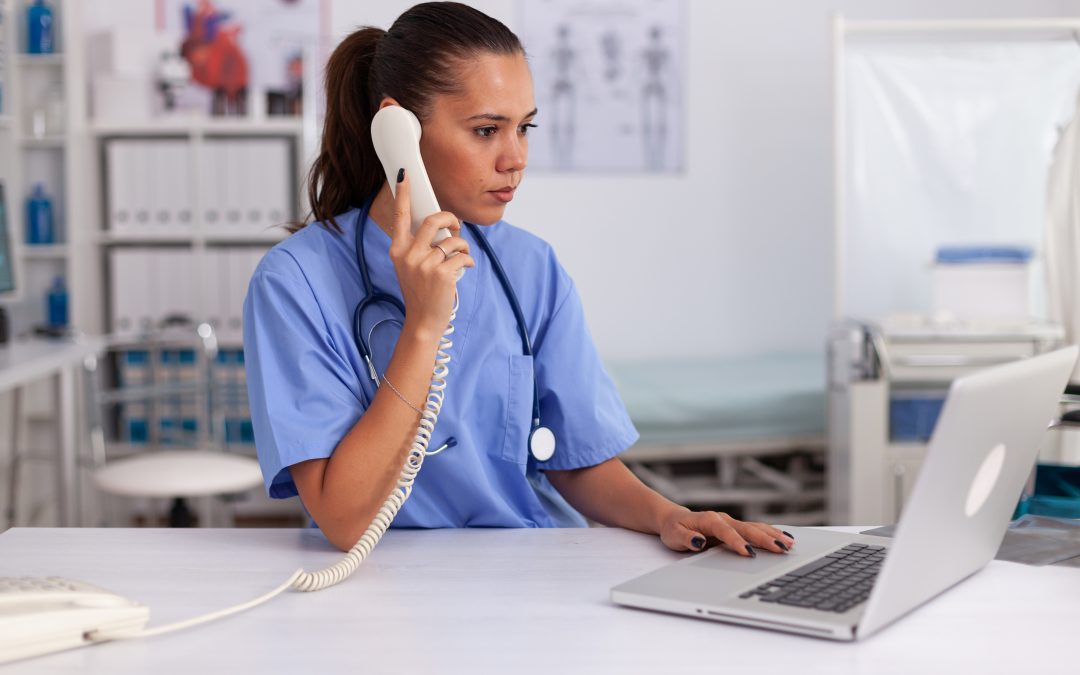 Medical secretary using practice management software - MidexPRO